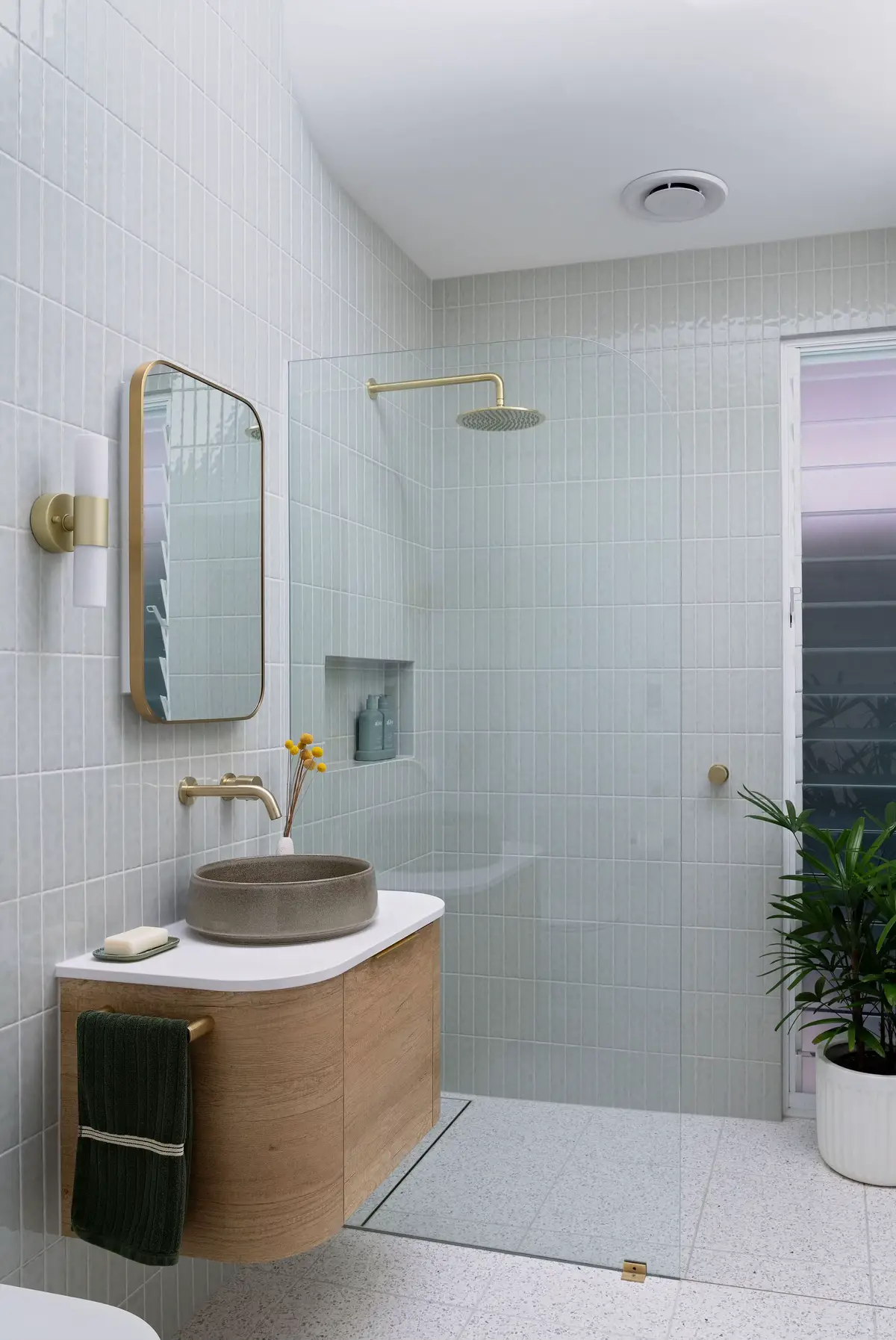 @maxwell.built have been busy working on their Elliot Ave build in South Australia. This is a true “modern coastal” style bathroom. Our sage green Newport minis on the wall in a vertical stack pattern paired with a timber vanity and brushed brass taps.  Beautiful ❤️