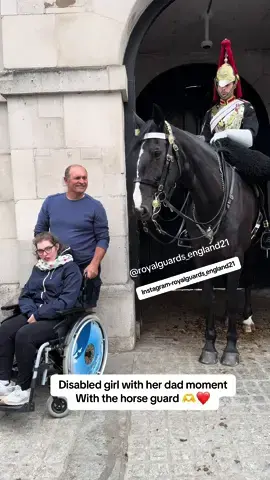 I like this armed police man because he gave disabled people a chance to get close to the horse guard to take a good picture, then the horse guard he really approached his horse to be able to take the pictures of the disabled propery bless them 🫶❤️ #fyp #highlight #everyone #royalguard #disabled #kingsguard #animals #royalfamily 