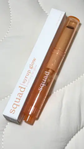 another squad cosmetics product review ✨ here we have the squad syrup glow, a melting lip glow which aims to provide a touch of color with an added glow to the lips. it does exactly what it says on the tin but i can’t really agree with the “melting” part of the product—having tried dasique’s melting candy balm, this product simply isn’t melty enough for me at all. sure, it melts a little bit when you warm it up but it’s still veers into being a solid stick of balm for me, just in a click-based packaging similar to that of melting balms like the aforementioned dasique and nature republic’s melting lip glow (although i haven’t tried nature republic’s version so i can’t comment on their formula). the clear orange packaging is really cute, and i actually quite like seeing the innards of the component—it brings a certain charm that’s similar to the appeal of clear game controllers and consoles. i do feel that the printed text will rub off after a while, but hey, at least the font’s cute (i am not yet over this rebranding 😅).  the shade sugar maple is a sheer red brown, and while it looks pretty deep in the packaging it’s incredibly sheer in real life. on my lips i only saw the faintest hint of color so don’t expect a lot of pigment because it’s just doing what it’s supposed to. when you need to dispense more product, make sure to only click a few times because there’s no way to return the product back into the tube once it’s out. even if you end up with some excess (like i did to see how melty it is), it’s not going to be messy when you put the cap back on thanks to the solid formula. still, i wouldn’t advise clicking out every bit of product. 😅 it doesn’t really state how many grams of product are in the package, but given the price point i can’t really complain. it’s pretty much a very sheer lip balm that’s really glossy but like i said, don’t expect this to melt on your lips. if you’re buying multiple shades, just be warned that these don’t have the names printed on the compontent so it could take a bit more effort to pick out the color you want. i do taste a little bit of the soapy flavor that the lip drip has when i use it but it's a lot milder on this product. other than that, if all this sounds like your thing then by all means get it—it’s a nice local lip balm to add to your collection. 🧡 #squadcosmetics #squadsyrupglow #squadmeltinglipglow #squadcosmeticssyrupglow #squadcosmeticsmeltinglipglow #squadsugarmaple #sugarmaplesyrupglow #squadlipglow #lipbalm #lipglow 