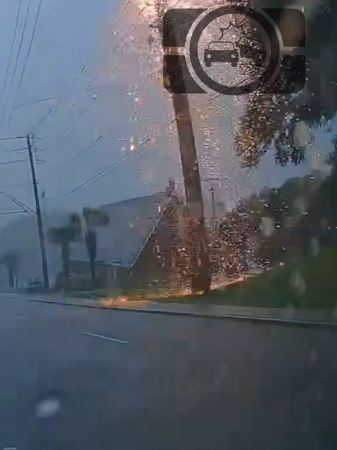 Lightning struck a power pole in front of me causing the transformer to blow up.