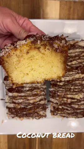 COCONUT BREAD!!! 🥥  INGREDIENTS: * 3 cups all purpose flour  * 1/2 teaspoon baking soda  * 1/2 teaspoon baking powder  * Scant teaspoon salt * 4 eggs * 2 cups sugar * 1/2 cup vegetable oil  * 1/2 cup melted butter * 2 teaspoons coconut extract  * 1/2 teaspoon vanilla extract  * 1 cup Buttermilk  * 1 cup shredded coconut * (Optional- 1/3 to 1/2 cup chopped macadamia nuts per pan) * Sprinkle of shredded coconut for bottom of each pan ***GLAZE: * 1 cup white sugar * 1/2 cup butter * 1/2 cup water * 1 teaspoon coconut extract  * 1 teaspoon vanilla ***TOPPING: * 1 cup coconut (Toasted) * 1/2 cup semisweet chocolate chips + 2 teaspoons coconut oil — melted in microwave) DIRECTIONS: > preheat oven to 350° > Toast 1 cup coconut on 350° (toast 2 min, toss and toast 2 more min). Set aside.  > Measure dry ingredients into a bowl. Lightly toss with fork and set aside.  > In large mixing bowl  mix eggs until creamy. Add oil ,butter, coconut and vanilla extracts & mix again.  > Alternate adding flour mixture and buttermilk. Don’t overmix.  Fold in 1 cup shredded coconut.  It is optional, but you can add chopped macadamia nuts to one or both loaves. Either fold them in, or layer some on the bottom and middle of the batter.  > Generously butter loaf pans. Sprinkle a little bit of coconut in the bottom of each pan.  (A few nuts if desired). Add batter carefully with spatula.  (nuts if desired) > Bake in preheated oven for 55-60 min. With about 10 min. left, prepare glaze. In saucepan stir together sugar and water. Bring to a boil, stirring. Add butter and simmer for 60 to 90 seconds stirring continuously. Removed from heat and add coconut and vanilla extracts.  > When bread is finished removed from oven. While still hot, sprinkle with toasted coconut (nuts also if desired). Drizzle evenly with hot syrup, leaving in the pan. Allow to stand in pan until completely cooled (2 to 3 hrs).  > Loosen edges with butter knife. Remove bread and place on platter.  Melt chocolate chips & coconut oil in microwave in bowl. Drizzle on top of bread.   >>ENJOY!!!  #coconutbread #coconut #toastedcoconut #bread #dessert #dreamweaver #garywright #easybaking #BakeWithMe #cookwithmimi #chocolate #glaze 