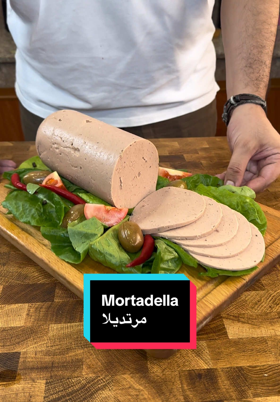 Mortadella  Way better than the store bought! Im serious Ingredients: - 2 chickens ( 900grams each) - 1 onion - couple of cloves of garlic - bay leaves - peppercorns - 1 star anise - 1 clove  - 4 cups of water - 50 grams of gelatin - salt & pepper - 1 tsp garlic powder - 1 tsp onion powder - 1 tsp paprika - 1/2 beetroot - 1 charcoal - 2 tbsps oul - boil the chicken with the aromatics for 2 hours or till they fall apart.  - debone the chicken and optionally smoke it with the charcoal for 10-15 minutes. - mix the gelatin with 2 scoops of the chicken stock. The less the better along with the spices. - grate half of the beetroot. Then add it to the chicken along with the gelatin mix. - blend it using a blender or a stand mixer for as long as you can. You want the mixture to be as smooth and creamy as possible. - cut a water bottle from the top. Spray it with some oil then pour the mixture in. Cover then place it in the fridge overnight. - slice it as thin or thick as you like. Serve it on sandwiches and enjoy. ( it will last up to 7 days in the fridge) #cooking #chicken #delicious #smoke #lunch