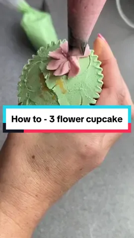 1 cupcake with 3 little flowers 🌺  Watch me pipe these small pink flowers onto a cupcake. I use a nozzle to mark where I want to put my flowers, this helps to keep the petals in a more uniform size. You will also see me using a 'coupler' with the green icing. This lets you use different decorating tips with the same bag of icing, creating several designs with the same colour. All nozzle details are in the video! My buttercream recipe is pinned at the top of my page! #cupcakeskills #cupcakedecorating #buttercreamflower #debbiebakes #cupcakepiping #cupcakebouquet  #buttercreamflowersvideo #howtopipebuttercream  #buttercreampiping #cupcakeoftheday #cupcakeflower #cupcakeflowertutorial #miniflowers #watchmecake #cake2024 #pinkflowers 