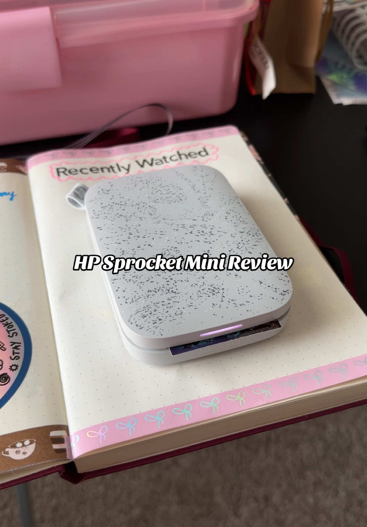 Mini review of the HP Sprocket! Bought this almost 6 months ago and it’s been so convenient to use when journaling. My most used ways is to print collages through the app for mini stickers of recent books I’ve read + TV shows and movies I’ve watched. The sticker photo paper means no glue or tape needed! #hpsprocket #photoprinter #journalingcommunity #bookjournal #portableprinter 