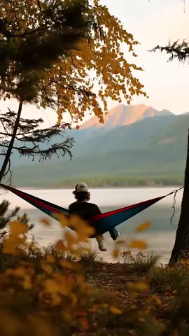 @Beauty Explorer In the heart of fall, surrounded by golden leaves, a boy swings peacefully while soaking in the majestic mountain views. The perfect way to enjoy the beauty of nature and the crisp autumn air. Would you love to be here? #FallVibes #AutumnBliss #MountainView #SwingInNature #SereneScapes #NatureLovers #PeacefulMoments 