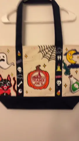 🎃SPOOKY TJ’s BAG👻 Custom handpainted Trader Joe’s canvas tote bag ~! Just in time for spooky season, this tote features all things halloween both new and old.  The paint is fabric paint and has been heat sealed to preserve the artwork. The tote is brand new with tags!  Now available on my Mercari/Depop shop ♡ #traderjoes #traderjoestote #traderjoesbag #halloween #spooky #paint #painting #tote #totebag #craft #crafting #hobby #artist #art #SmallBusiness #handmade #fyp #faeriefoxxe 