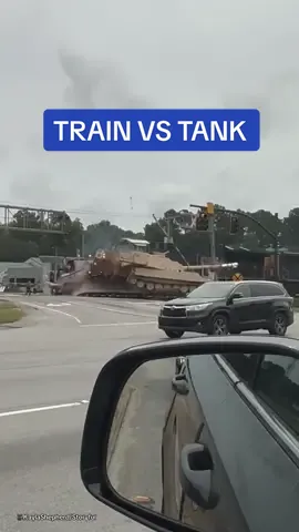 A train slammed into a semi-truck that was transporting a tank after it got stuck trying to manoeuvre around a crossing in South Carolina.  Local news reported that there were no injuries.  🎥KaylaShepherd/Storyful  #tank #train #traffic #cars #smash #military #cargo #railway #southcarolina #usa 