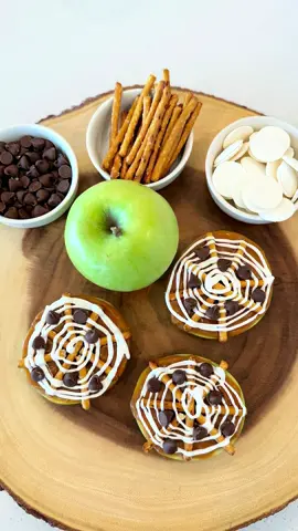 Spider Web Caramel Apple Slices🕷️🍏 These are a fun and festive snack to make this spooky season! The ingredients you need are granny smith apples, pretzel sticks, caramel, white chocolate and mini chocolate chips. Enjoy!✨ #spookyseason #halloween #caramelapple #HalloweenTreats #EasyRecipes #fallrecipes #halloweenpartyideas #falltreats #kidshalloweencraft #fallfoodideas 