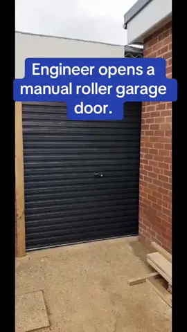Engineer demonstrates how to open and close a single skin roller garage door. #gliderol #manualrollerdoor #rollerdoor #garagedoor #manualdoor #singleskin #anthracitegrey