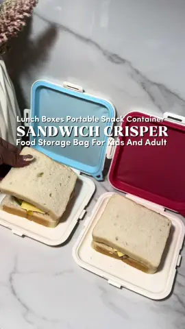 Snack on the go in style! These colorful sandwich holders keep your food fresh and spill-free! 💯✨ Perfect for kids and adults #sandwich #lunchboxes #foodstorage #container 