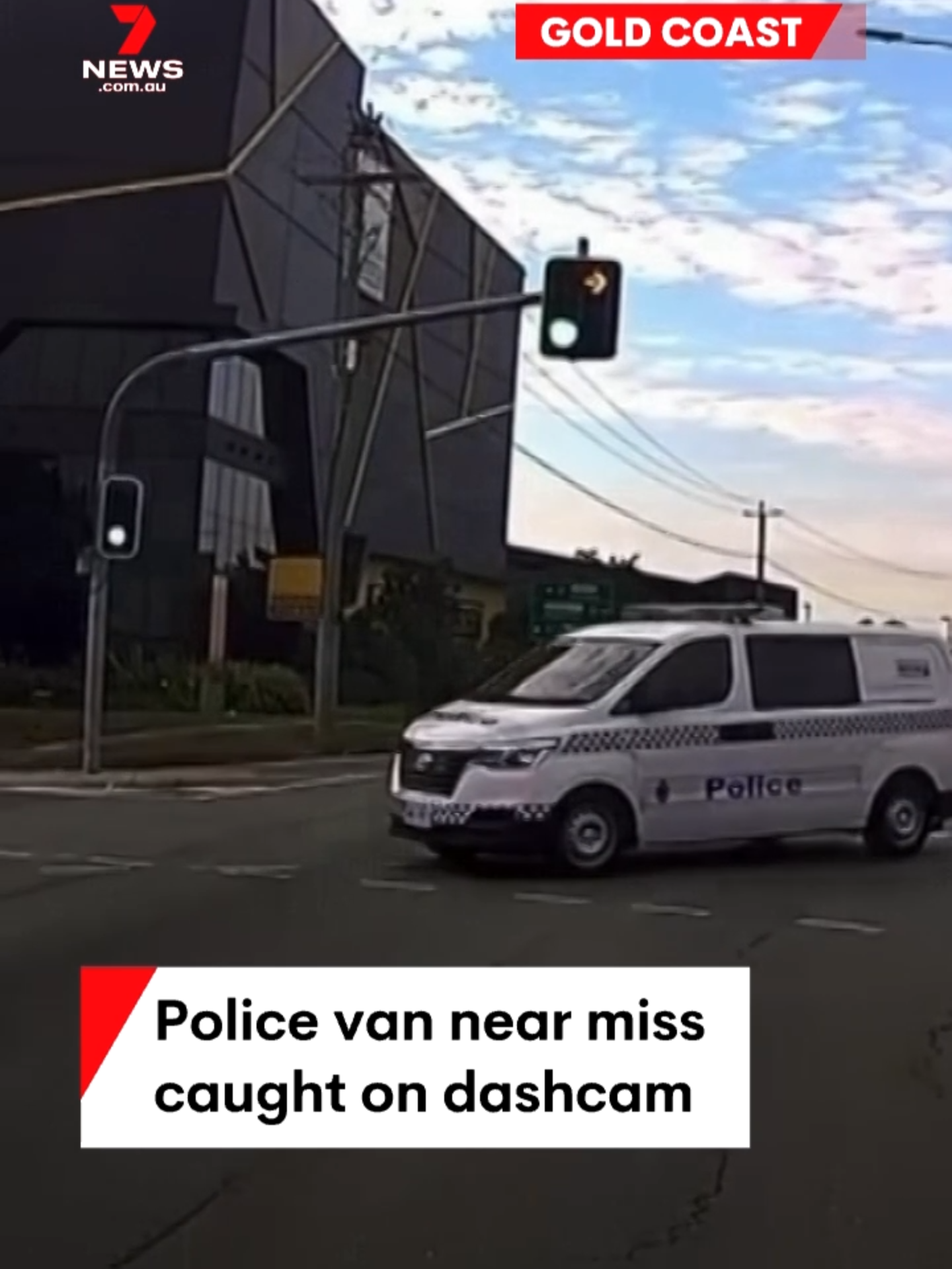 A police officer's close call has been caught on dashcam. The marked police van fails to give way at a busy Gold Coast intersection, turning into oncoming traffic and narrowly missing a white jeep. #nearmiss #car #traffic #GoldCoast #police #7NEWS