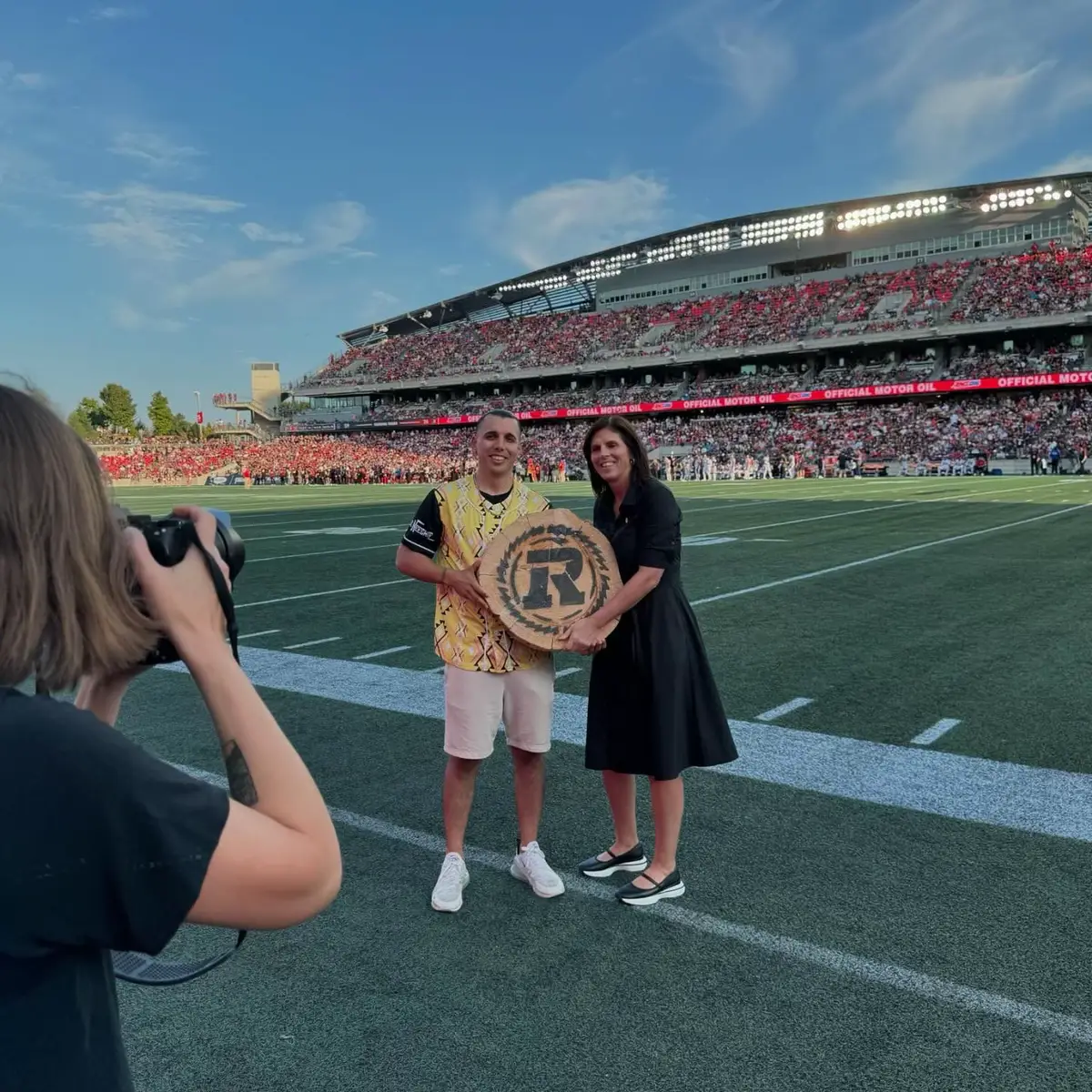 Wow, what an incredible day! 😁 A huge miigwech (Thank you) to the Ottawa REDBLACKS and the OSEG Foundation for presenting me with their Wood Cookie award and recognizing the work I’ve been doing throughout the years. It’s an honour to stand alongside a team that embodies resilience, heart and the spirit of this city. 🙌🏽 As an artist, storyteller and proud community member being recognized by such an iconic organization means so much to me. I’m grateful to be part of a place where we celebrate unity, diversity, inclusivity and how the power of sports and music can bring us together. 🏈🪶 Go RedBlacks! 🖤❤️  #RNation #OttawaREDBLACKS #WoodCookieAward #OttawaPride #CFL #ottawa #ottawacanada #ottawaontario #indigenous #IndigenousTikTok #native #nativetiktok #firstnations #firstnationstiktok 