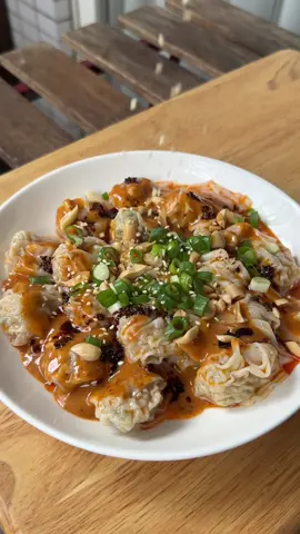 SPICY SATAY WONTONS 🥟🥜🔥 it’s a quick, easy, and delicious way to add a little heat and excitement to your weeknight dinners.   - 24 x frozen wontons (or dumplings)   Spicy Peanut Sauce - 3 tbsp creamy or natural peanut butter - 2 tbsp chili oil (homemade recipe on my feed) - 2 tbsp light soy sauce - 1 1/2 tbsp rice vinegar - 2 cloves garlic, finely minced - 1 tsp caster sugar - 1/4 cup hot water  Garnish - Chilli oil - Roasted Peanuts - Spring onion, chopped - Toasted white sesame seeds   To make the spicy peanut sauce, combine all sauce ingredients in a blender and blitz until smooth. Alternatively, whisk together in a bowl until well combined. Taste and adjust seasoning to your liking. Boil the wontons according to the packet instructions. Toss them in a bit of chilli oil for extra flavour. Divide the wontons into serving bowls, then drizzle generously with the spicy peanut sauce. Top with extra chilli oil, roasted peanuts, chopped spring onion, and sesame seeds. #Satay #ChilliOil #PeanutSauce #Wontons #FrozenWontons #Dumplings #FrozenDumplings #FYP #Cooking #Recipes 