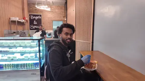 Open 24/7! It was an honour and a privilege to bless our brother @Damal-AuthenticSomaliFlavours  with our most popular spud. Since our opening on 6th September we have raised huge sums for our charity cause mainly because of this top-seller. The Chilli Con Carne filled spud with or without grated mixed cheeses is the perfect solution to a long day.  We cook this secret recipe dish fresh daily on site. Accompanied with our soft jacket potatoes, it makes a bold statement that is only understood once experienced. Pop over to Bagels & Spudz right now and get a mouthful of flavoursome Chilli Con Carne on your hot spud. #bagel #spud #cake #drink #food #fyp #funnyvideos #satisfyingvideo #trendingvideo #tiktokviral #Fitness #healthy #vegan #tasty #lovely #real #goodvibes #london #24 #7 
