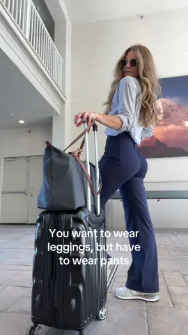 Its giving corporate mom walking in the airport 