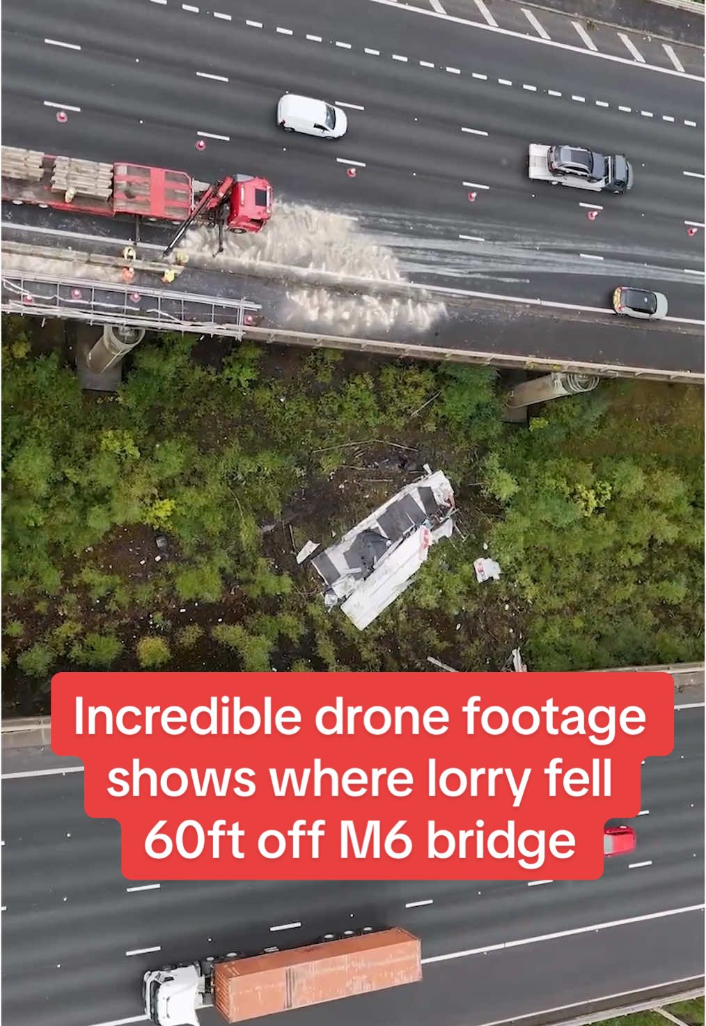Incredible drone footage shows where lorry fell 60ft off M6 bridge. The driver has not suffered life-threatening injuries #fyp #dailymirror #breakingnews 