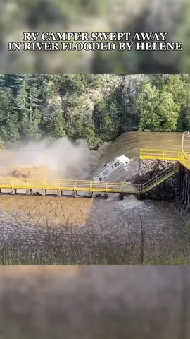 A recreational vehicle was captured on video being swept away by a gushing river in Virginia as remnants of Hurricane Helene caused widespread flooding last month. The dramatic footage of the camper was captured by Benjamin Laparra near Fries on September 27. #helene #hurricanehelene #virginia 