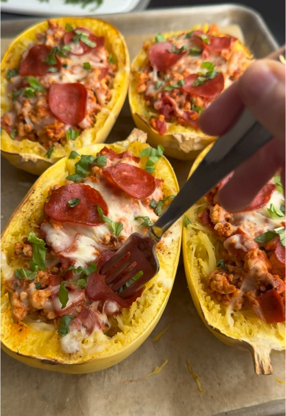 PIZZA SPAGHETTI SQUASH BOATS 🍕 Full of protein and fiber to keep you full, and delicious cheesy pizza goodness to keep you satisfied. 🤩 Ingredients: 2 small spaghetti squash (~2lbs each) pinch salt and pepper to taste 1 lb 99% lean ground turkey 2 tsp Italian seasoning 2 cups marinara sauce (452 g) 1/2 5oz bag turkey pepperoni (75 g) roughly chopped 1 cup mozzarella (84 g) fresh grated is best fresh basil optional, for topping Instructions: 1. Preheat oven to 400 F and line a half baking sheet with parchment. Cut the squash in half lengthwise and remove the seeds. Lightly spray with olive oil and season with a small pinch of salt and pepper. Place face down on the baking sheet and bake for 30 minutes. 2. Halfway through squash baking, heat a large frying pan on medium high heat, spray with olive oil and add turkey. Cook the turkey, breaking apart into small pieces, until fully cooked. Season with more salt (I do about 1 tsp), pepper, and the Italian seasoning. 3. Turn the heat down and add marinara sauce, roughly chopped pepperoni (save a few for topping) and stir together. Let gently cook for about 5 minutes to let the flavors combine, the remove from heat. 4. After the squash are done baking, let cool slightly, then flip over and shred into strands with two forks. Top them with the meat sauce, mozzarella cheese and a few whole pepperonis. Put back in the oven to melt the cheese, about 5 minutes. 5. Once cheese is nice and melty, remove from oven, top with fresh basil if desired and enjoy! For the full recipe, tips and nutrition, search 🔎 “pizza spaghetti squash boats” at the 🔗 in my bio or at myproteinpantry.com 👩🏻‍🍳 #highprotein #EasyRecipes #healthyfood #healthyrecipes #healthylifestyle #dinner #pizza #spaghettisquash