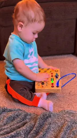 My 10 month old has been getting a little too much screentime lately! I loved watching his little wheels spin while playing with this busy board! #busyboard #toddlertoys #montessori #montessoritoddler #sensoryactivities #sensoryboard #traveltoys 