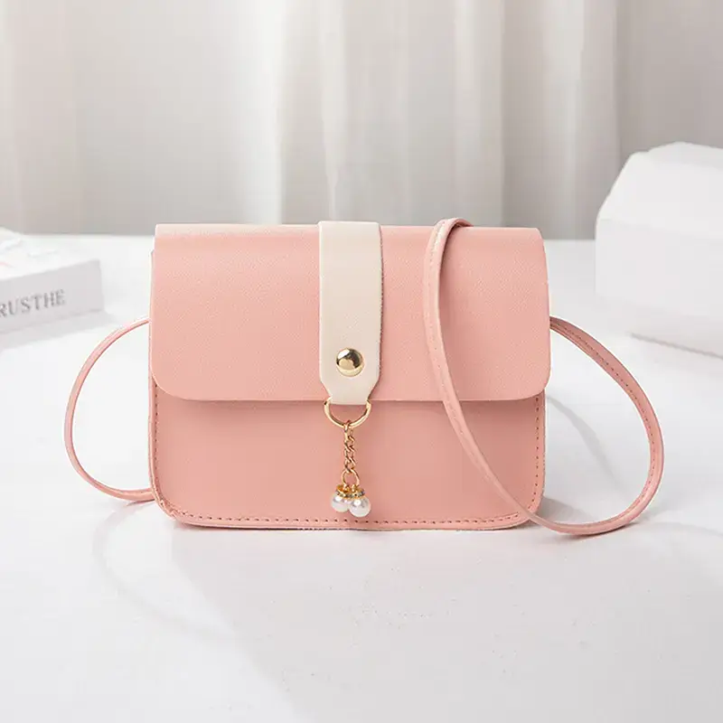 ✨ Elevate your style game with our Pearl Pendant Fashion Small Shoulder Bag! Perfect for a night out or just running errands, this chic PU leather crossbody is your new go-to for keeping your essentials close. 💖📱 Grab yours and let your outfit shine! #FashionGoals #CrossbodyBag #StyleInspo #PurseAddict #OOTD #ChicAndTrendy