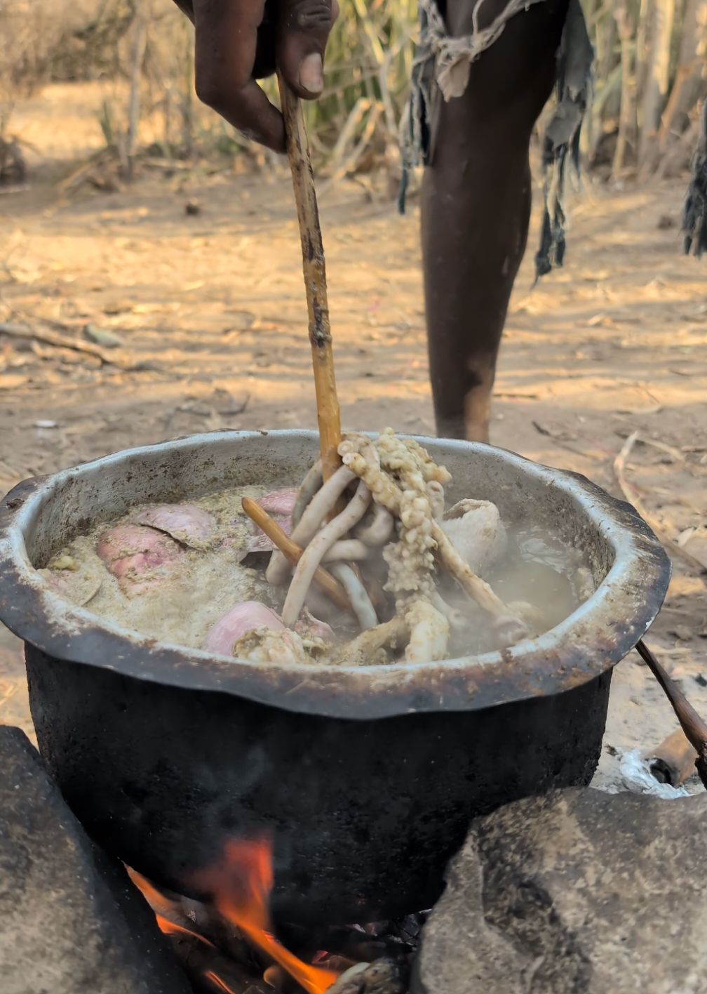 Hadzabe boy making his favorite Soup middle of nowhere ‼️😋#villagelife #hadzabetribe #africatribes #USA