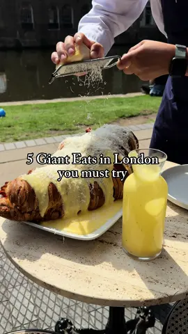 5 Giant Eats in London You Need to Try! 🍴 1. The massive Giant Gyros from Tasty Gyros in Enfield. 2. The largest croissants in London, found at Caffe Corretto and in Hawley Wharf, Camden. 3. The ultimate XL 10-patty cheeseburger from Peckish Burgers in Camden Market. 4. A whole meter of pizza from Pizza Metro in Battersea Rise. 5. London’s biggest cup of tiramisu from Tarantella Chiswick. Who’s up for the challenge? 😋  #londoneats #giantfood #foodielondon #londonfood #londonfoodguide #mustyrylondon #camdenfood #camdenmarket #camdentown #battersearise #chiswicklondon #londonfoodie #streetfoodlindon #gianttiramisu #giantburger #london #londra #wheretoeatinlondon #whattoeatinlondon #londonthingstodo 