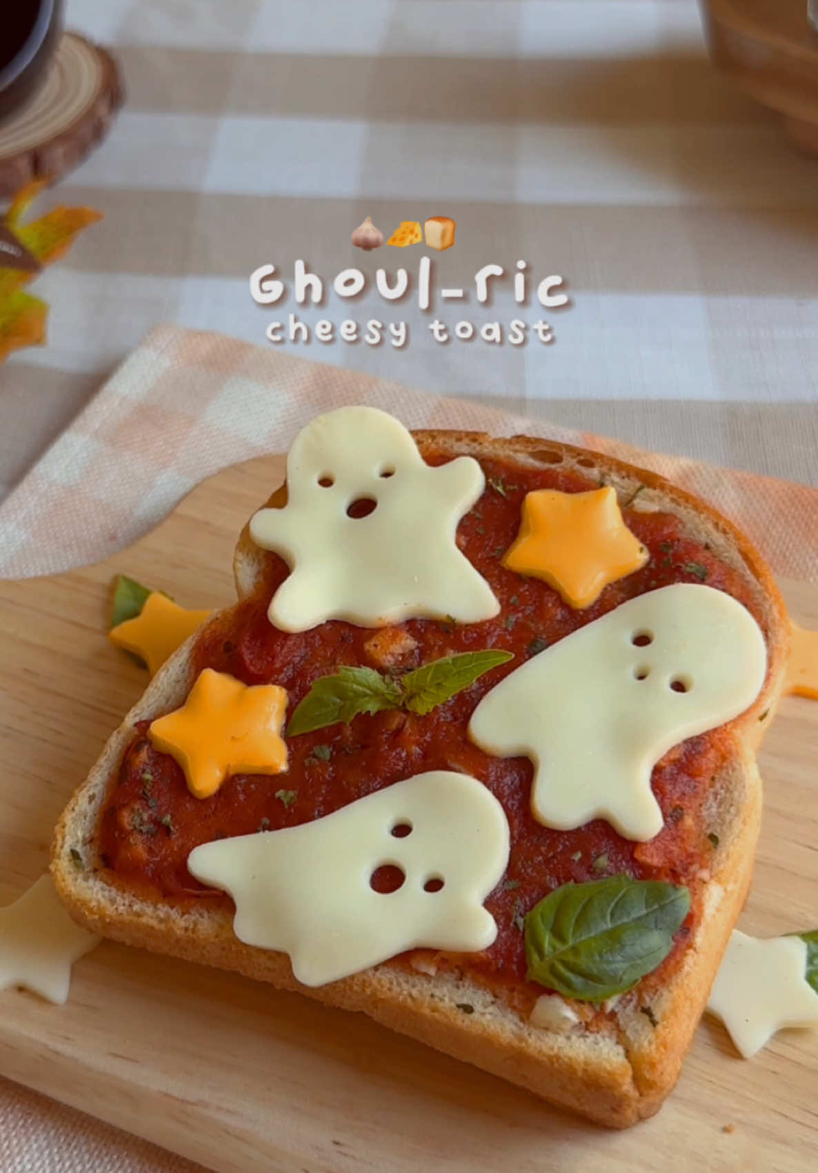 Ghoul-ric Cheesy Toast 🧄🧀 You really can’t go wrong with garlic butter and cheese on toast! I love adding a little pizza sauce to turn it into a mini garlic cheesy pizza toast. Feel free to top it with whatever you like—and for a spooky touch, I made mine extra fun with ghost-shaped cutouts! Perfect for a cozy Halloween treat that everyone will love 👻🍕 Find more fun recipes and cute kitchen tools on my website! Link in bio✨ Garlic Butter Recipe: * 3 tbsp unsalted butter 🧈  * 2 garlic cloves, minced 🧄  * 1/4 tsp parsley 🌿  Instructions: 1. Spread the garlic butter evenly on two slices of toast. Bake at 350°F for 7 minutes. 2. Remove the toast from the oven and add mozzarella cheese between the slices. 3. Spread pizza sauce or marinara on top. Feel free to add your favorite toppings, like pepperoni or extra cheese. 4. Bake for another 7 minutes, or until the cheese is melted. #cheesytoast #cheesetoast #cheesepull #halloweenfood #halloweensnacks #halloweeneats #halloweenishere 