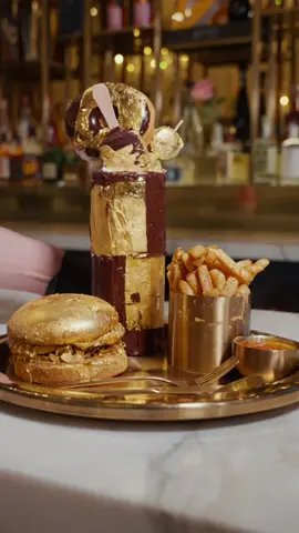 Indulge in luxury with every bite! ✨🍔 Our 24K Gold Burger. #goldburger #luxuryfood 