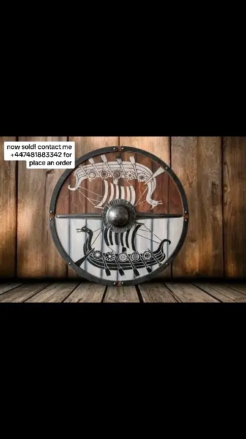 Handmade Viking shield with intricate carvings, crafted from solid wood, reinforced with iron accents, and featuring a leather grip. Ideal for display or reenactments. #fyp #trending #trendingvideo #TikTokShop #vikingshield #handmadeshields #vikinggear #medievalarmor #shieldwall #reenactment #warrior #viking #vikingrise #vikingtok #replicachallenge 