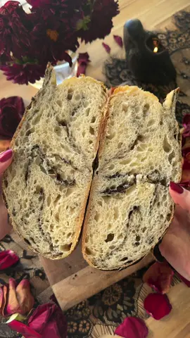 Love the slightly black marbled crumb on this loaf. It was made by sprinkling black cocoa powder into the dough during stretch and folds. 🥰🖤 The crumb turned out so lacy-delicious. It was perfect with butter. I also found a fun little surprise when I cut it.  Do you see it? 🦉  #crumbshot #sourdough #artisanbread #asmr #crunch #bread #breadmaking #fallbaking #cozy #roses #starbread 