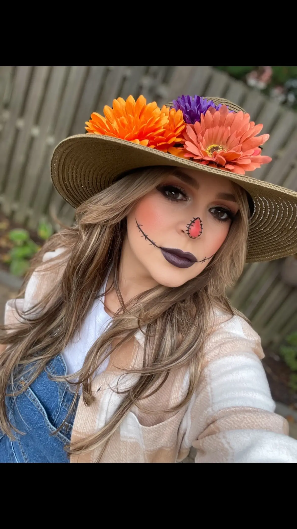 Here’s a super easy costume you can create with items you probably already have.  🎃 Plaid Buttondown  🎃 Denim Overalls 🎃 Dollar Tree Flowers 🎃 Wide Brim Hat I did have to buy the overalls which I found on sale at Target.  #halloweenmakeup #scarecrow #costumeideas #lastminutehalloweencostumes #diycostumes 