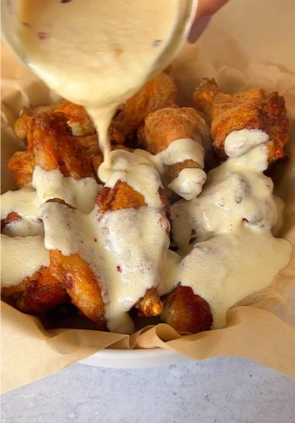 ✨Alfredo Chicken Wings✨ I know you’ve had Alfredo sauce on pasta, but have you tried it on wings? If you haven’t, I am about to change your life with these 🍗 Alfredo Chicken Wings. This recipe is not only delicious but incredibly easy! The Alfredo sauce just takes ⏲️ 30 minutes from start to finish, and I suggest you make double as you won’t be able to get enough. Ingredients * 2.5 lbs chicken wings, about 20 wings * 2 tablespoons avocado oil, any oil you prefer * ½ teaspoon salt, to taste * ½ teaspoon pepper, to taste * 1 head garlic * ¼ teaspoon oil * pinch salt and pepper, to taste * 1 tablespoon butter * chili flakes, optional * ⅓ cup half and half, or heavy cream * ½ cup Parmigiano Reggiano cheese, grated https://themodernnonna.com/alfredo-chicken-wings/ #chickenwings #wings #alfredo #alfredowings #wingsrecipe #recipes #recipetok 