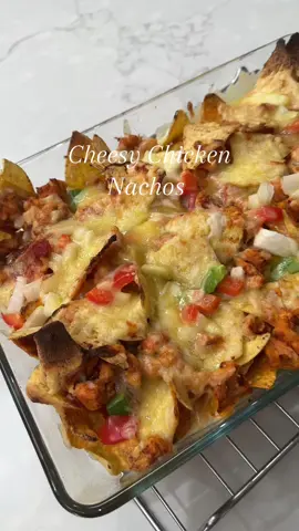 Cheesy Chicken Nachos I wanted to make guacamole but my avocado was brown ☹️🥲 X2 Chicken Breasts - cut in small pieces  All purpose seasoning - 1tsp  BBQ seasoning - 1tsp  Onion granules - half tsp  Chicken seasoning - half tsp  Chilli powder - 1/4 tsp  Crushed chillies - a pinch  Salt - 1tsp  Mix well Add in pan with some oil and cook for 15-20mins Pre heat oven at 200 degrees  Later in tray with some salsa , onion and peppers and cheese  Layer however you want too. Place in oven for 12-15 mins at 200 degrees until cheese melts!! Enjoy 🫰🏽 #foryou #fyp #foodpage #cheesy #chickennachos #nachos #chicken #foodpage #fypp #fyp #foryoupageee #foryo #cheesy #peppers #doritos #salsa #chicken #cheese #foodpage #foodforyou #fyppp #xyzabc #quickfood #Recipe #FoodTok #cookwithme #nachos #cinemadate #snacks 