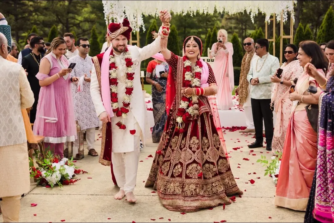 Nitika & Chip's fusion wedding in Asheville, NC, was a vibrant and unique celebration! Set against the stunning backdrop of Asheville, this beautiful celebration was a perfect blend of two cultures, two families, and two days filled with pure joy ❤️ Here’s to love, laughter, and unforgettable memories!  To read more about their wedding, check out the link in our bio! 💫 Planning & Design: @idoashevilleweddings Wedding Venue: @chestnutridgevenue  Reception Venue: @therestorationhotelchs  Cinematography: @Martin Wedding Films  Photography: @natashadaleportraits  #FusionWedding #AshevilleWeddings #maharaniweddings #indianwedding #indianwedding #christianwedding #whitewedding #weddinggown #weddinglehenga #redlehenga #outdoorwedding #gardenwedding #indianbride 