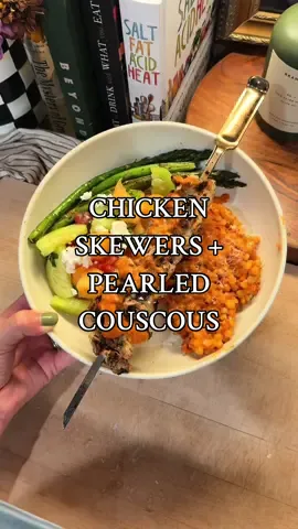 Chicken skewers topped with a spicy sun dried tomato sauce served with pearled couscous 🌶️🥫 Chicken Skewer Ingredients: 4 chicken breasts, cubed 1/2 cup olive oil 3 tbsp white wine vinegar Juice of 1 lemon 1 tbsp hot honey 5 garlic cloves, minced 3 tbsp sun dried tomatoes, chopped 1 tbsp dijon mustard ½ tsp Oregano ½ tsp Basil ½ tsp Parsley ½ tsp Salt ¼ tsp Pepper ¼ tsp red pepper flakes  ¼ cup shredded parmesan cheese Method: I cut some chicken breasts into large chunks. In a bowl, mix all marinade ingredients together. Pour over your chicken breast chunks and let it sit in the fridge for about an hour (can do longer if desired) before adding to some skewers. We grilled them on medium/high heat for about 10 minutes total, flipping halfway through (until the meat thermometer read 165).  Pearled Couscous: **I made the sauce first, set aside enough of it to pour a little over our chicken skewers at the end, and then used the remaining for the couscous. Ingredients: 8 oz pearled couscous  2 tbsp olive oil 1 shallot, diced 8 cloves garlic, minced 1/4 cup sun dried tomatoes, chopped  6 oz tomato paste 2 tbsp Calabrian chilis, chopped  1/4 cup white wine 1 1/2 cups heavy cream 2 tbsp butter 1/4 cup shredded parmesan cheese Salt and pepper, to taste Method: -Cook your pearled couscous according to the package and set aside. I like to slightly brown mine in a little olive oil first, and then use chicken broth to cook it.  -In a large saucepan, heat up olive oil over medium heat. Add shallot and saute for a few minutes before adding the garlic. Saute for another minute or so, stirring frequently so the shallots and garlic do not burn.  -Add sun dried tomatoes, calabrian chili, and tomato paste and let cook for about 5 minutes or so, stirring frequently. You will notice the tomato paste will start to turn a darker red color.  -Add wine, stirring until it cooks down and there is no more liquid in your pan. -Reduce heat to med/low. Add heavy cream, salt, pepper, and parmesan. Stir well until combined before adding the butter.  -This is where I reserved a little bit of the sauce to set aside to serve on top of the chicken when plating my dish.  -Add cooked pearl couscous directly to the sauce, mix well, and top it off with extra parmesan if desired #dinner #dinnerinspo #DinnerIdeas #mealinspo #mealideas #cooking #Recipe #yum