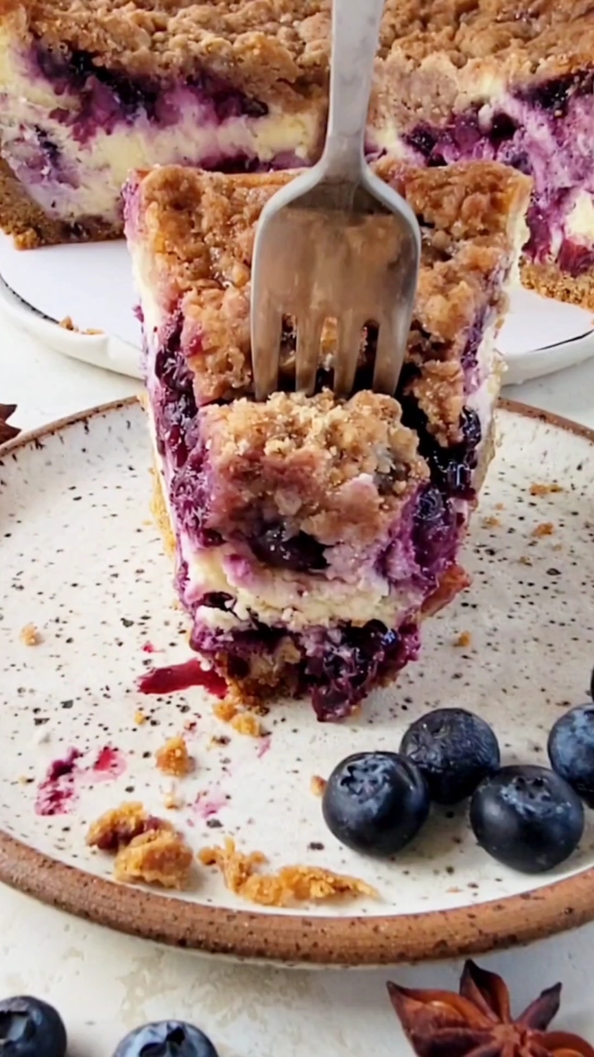 This Blueberry Crumble Cheesecake (recipe below) has a velvety smooth cheesecake filling that is studded with a homemade blueberry jam. The cheesecake is topped with a buttery, brown sugar cinnamon crumb topping, adding the perfect crunchy contrast in texture to the smooth cheesecake. Find the full recipe on my blog, simplebakingwithpep.com as well as below.  Blueberry Crumble Cheesecake Graham Cracker Crust 1 ¾ cups graham cracker crumbs (161 grams) 3 tablespoons brown sugar (39 grams) 6 tablespoons unsalted butter (3 ounces) Filling 1 cup granulated sugar (200 grams) 24 ounces (3 8-ounce packages) cream cheese, room temperature ¼ cup sour cream (61 grams) 2 teaspoons vanilla extract (8 grams) 3 large eggs ¼ cup heavy cream (60 mL) Blueberry Jam 3 cups fresh blueberries (450 grams) 1/3 cup water (79 mL) ¼ cup granulated sugar (50 grams) 1 tablespoon cornstarch (7 grams) ½ teaspoon cinnamon (optional) (1 gram) Crumble Topping 1 cup all-purpose flour (125 grams) ¼ cup granulated sugar (50 grams) 6 tablespoons brown sugar (75 grams) 2 teaspoons ground cinnamon (5 grams) 6 tablespoons unsalted butter, melted (3 ounces) 📌 instructions in comments #cheesecake #blueberry #blueberrycheesecake #dessert #baking #homemade #thebakefeed #nytcooking #imsomartha #EasyRecipe #Foodie #foodfluffer #food52 #food52grams #buzzfeedtasty #f52community #huffposttaste #huffpostfood #creamcheese #grahamcracker #todayfood #bhgfood #tohfoodie