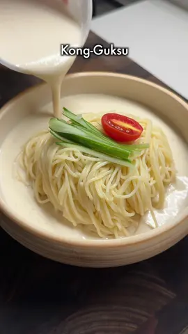Cold Noodles in Korea : Kong-Guksu This is a dish loved in Korea for its creamy, nutty, and refreshing flavors. Ingredients - Noodles (wheat flour noodles recommended, but capellini pasta can be substituted if unavailable) - Tofu - Salt - Sugar - Roasted sesame seeds - Peanut butter - Cucumber - Tomato Recipe (Serves 2) 1. Soak capellini pasta in cold water for 2 hours. (This step enhances the noodles’ chewy texture. If short on time, boil for 10 minutes until fully cooked, not al dente.) 2. In a blender, add 500g of tofu and fill the tofu container with water 1.5 times (maintaining a 2:3 tofu-to-water ratio). 3. Add 2 tablespoons of sugar, 1 tablespoon of salt, 4 tablespoons of roasted sesame seeds, and 2 tablespoons of peanut butter, then blend until smooth (1~2 minutes). 4. Mix the cooked noodles with the blended tofu sauce, then garnish with sliced cucumber and tomato to finish. Tip - Adding a bit of salt while eating will enhance the nutty flavor.