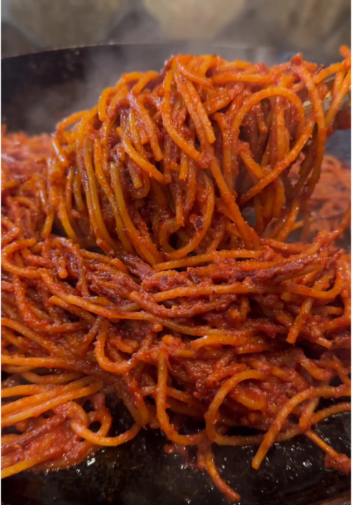 The legendary Spaghetti All’assassina otherwise known as Assassins Spaghetti is cooked in a way you’ve never had pasta before and that’s because the sauce is inside the pasta 🍝🤤 For more recipes just like this, go grab my new ebooks “The Undrafted Chef” & “The Undrafted Chef Vol 2” Website link 🔗 is on my profile page or just go to 👇🏾www.ChefBoydBrownlll.com Ingredients:  12-14 oz Dry Spaghetti  28 oz Tomato Puree  5 oz Tomato Paste  2 ½ Cups Water  ½ Cup Extra Virgin Olive  6 Cloves Fresh Garlic (4 thinly sliced & 2 minced)  2-3 Whole Fresh Red Chili Peppers minced or 1 Tbsp of Red Chili Flakes (or spice level preferred)  2-3 Pinches of Kosher Salt (or to taste)  Instructions: This recipe requires cooking the pasta from start to finish in the skillet. Use a pan at least 14 inches in size, ideally seasoned cast iron or carbon steel. Make the Tomato Broth: Reserve 3/4 cup of tomato purée for later. In a large pot over medium-low heat, combine water, 22 oz tomato purée, tomato paste, and salt. Simmer, then remove from heat. Heat olive oil in a skillet over medium. Add garlic and pepper, sauté until golden but not burnt. Fry the Pasta: Add the reserved 3/4 cup tomato purée to the pan with oil, garlic, and chilies. Stir and reduce for 1 minute. Add dry spaghetti in a single layer. Raise heat to medium and fry until golden, about 1 minute. Carefully flip pasta to fry the other side. Start adding tomato broth with a ladle, a few ladles at a time. Slowly Cook the Pasta: Add 3 ladles of tomato broth to the pasta. Cook like risotto, waiting for the broth to reduce and hearing the ‘sizzle’ before adding more broth. Repeat until pasta is cooked through, moving it around the pan. Once softened, stir to prevent sticking. Serve immediately, garnished with parmesan and fresh basil. #pasta #spaghetti #italianfood #foodies #EasyRecipes #Recipe #foodtiktok 