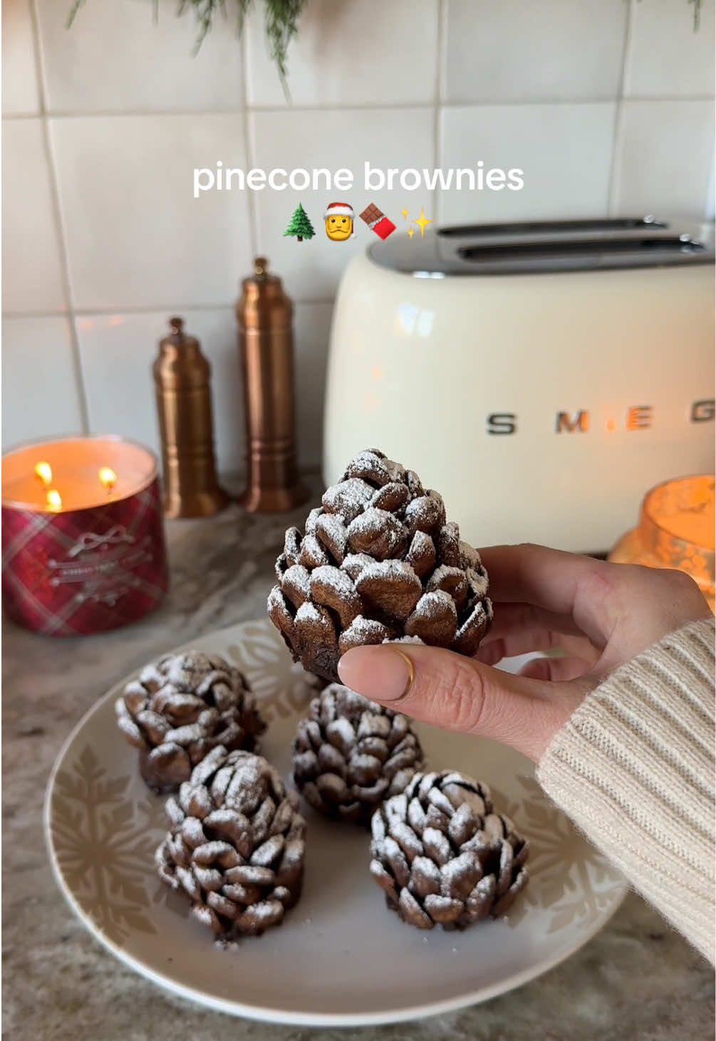 Pinecone brownies 🌲🍫 I couldn’t believe how cute these turned out!  Ingredients- -1 box brownies, baked and cooled -chocolate, melted -chocolate cereal (premiere protein) -powdered sugar 1. Break up the brownies in a large bowl using an electric beater until a dough has formed.  2. Shape into a cone, then dip into the melted chocolate- only one at a time. 3. Starting at the top, press the cereal pieces into the brownie cones. 4. Sift with powdered sugar to look like snow. #christmasmood #christmasaesthetic #christmasbaking #christmastok #christmastiktok 