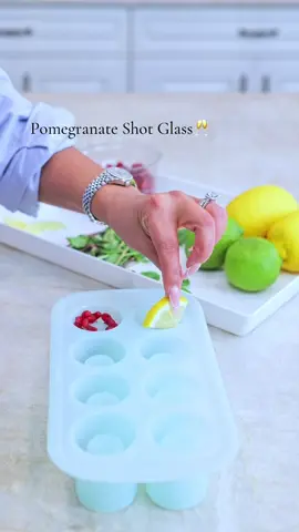 I’m loving this shot glass mold!! For the first one, I put mint leaves, lemon, lime, & pomegranate seeds. So good. Filled with a nice vodka and lime cocktail🥂 And second one, I used 2 packs of mints. Put 12 to 13 mints in each mold. Make sure you put 2 to 3 on top. Put in oven for 15min at 350. Let cool down until hard. Take out of mold. I filled mines with egg nog yummy!! Bailey’s, Coquito or whatever you like. Make these for the holidays and Thank Me Later🥂 The mold is oven safe. I’m gonna make cookie shot glasses next. With a creamy liquor inside. YUMMY😋  #kitchenideas #cookingvideos #cookingvideo #holidays #holidayrecipes #holidaybaking #holidayathome