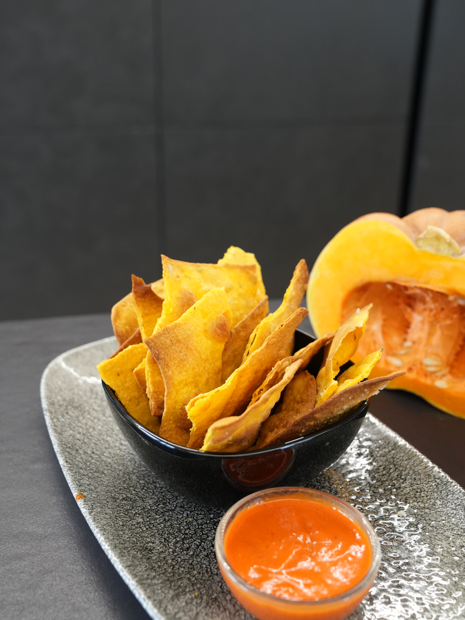 Crispy, herbed Pumpkin Chips with Roasted Pepper Dip 🍂🍁🧄 Perfect for fall snacking!🧡 #PumpkinChips #FallFlavors Ingredients: For the Chips: ● 1 cup pumpkin purée (200 g) ● 3 ⅓ cups all-purpose flour (400 g) ● 2 tablespoons extra virgin olive oil (25 g) ● Mixed herbs (such as rosemary, thyme), to taste ● Salt, to taste For the Roasted Pepper Dip: ● 2 bell peppers ● 1 garlic clove ● Fresh thyme, to taste ● A pinch of red pepper flakes ● 1 tablespoon ketchup ● Extra virgin olive oil, to taste ● Salt and pepper, to taste