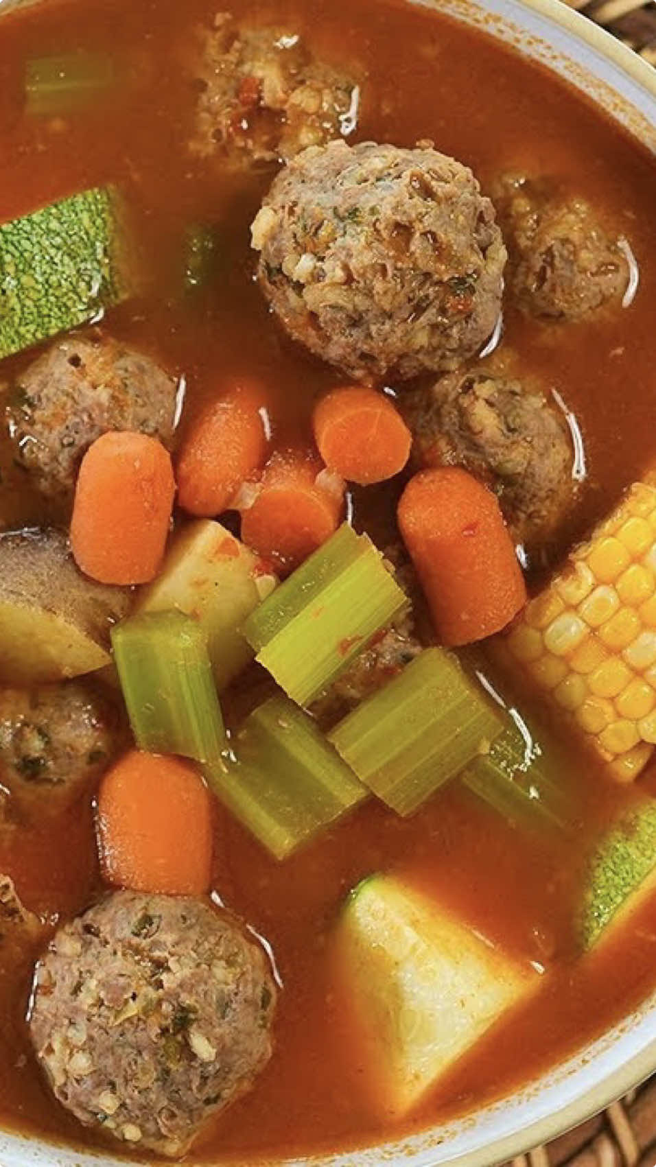 It’s caldo season and let me share with you the CALDO DE ALBÓNDIGAS I grew up eating and now it’s my kids favorite.  Ingredients:     For the broth: 5 Roma tomatoes 1/4 onion 2 garlic cloves 1/2 red bell pepper 1 can tomato sauce 1 tsp ground cumin 4 tbsp chicken bouillon  1-2 tbsp tomato bouillon or 1 pack sazón hoya 10 cups water; divided       For the meatballs: 2 lbs lean ground beef 1 tbsp all purpose flour 1 tsp oregano, black pepper, garlic salt  1 1/2 tsp salt 1/2 onion; small diced 1/2 bunch cilantro or yerbabuena; finely chopped 1 minced garlic clove 1 egg 1/2 cup uncooked white rice      For the caldo 2 corn 3 medium potatoes 4 celery stalks  1/2 lb baby carrots 1 calabacita  1 serving of love 💕  #caldodealbondigas #meatballsoup #soupseason #caldos #recetasfaciles #mexicanrecipes #RecetasDeliciosas