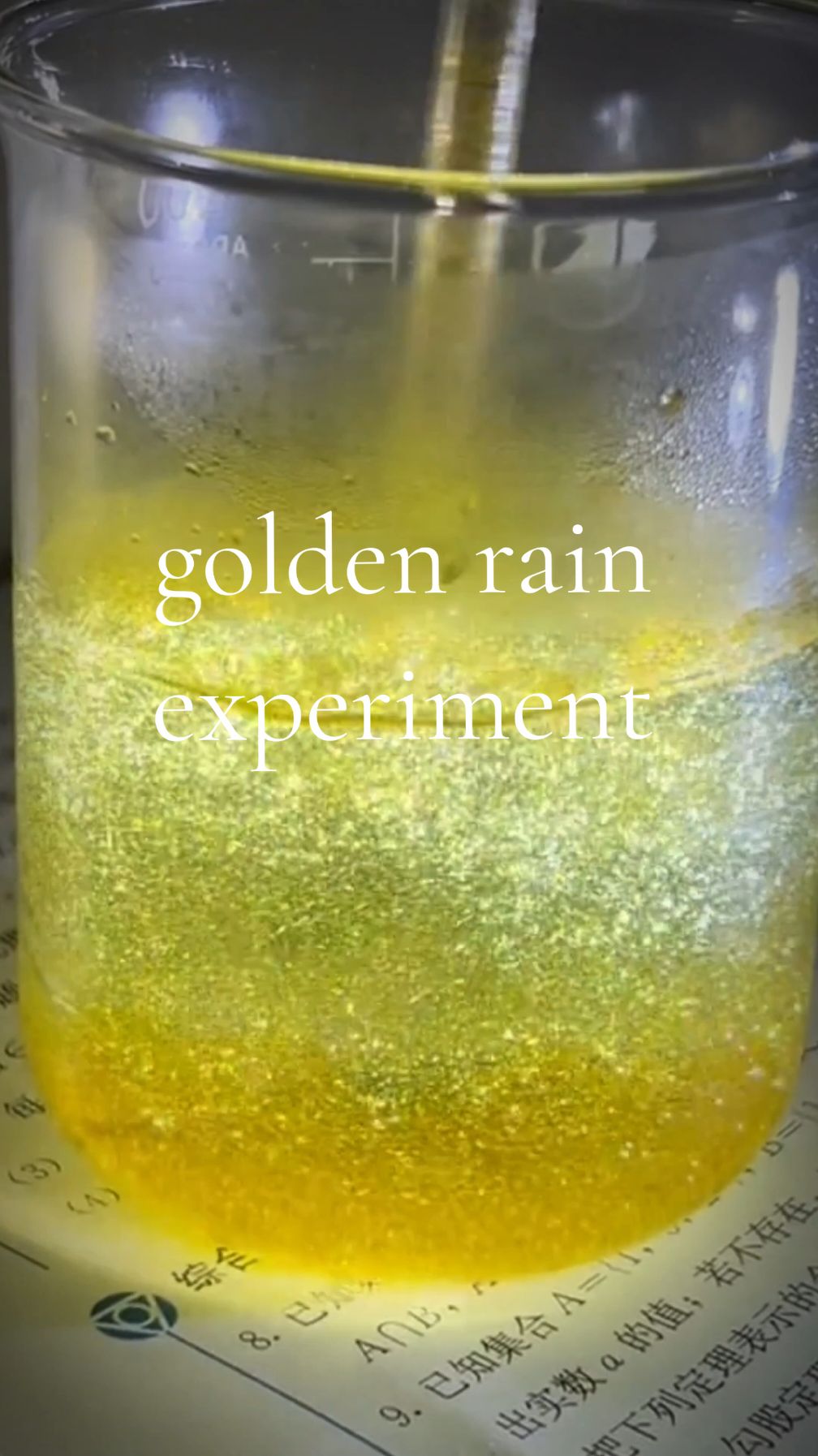 The golden rain experiment creates a beautiful display of gold-colored crystals raining down in water. Here’s a quick breakdown: When a solution of potassium iodide (KI) is mixed with lead(II) nitrate (Pb(NO₃)₂), they react to form lead(II) iodide (PbI₂), a bright yellow precipitate. By heating the solution, the lead iodide dissolves, and as it cools down, golden yellow crystals form, looking like 