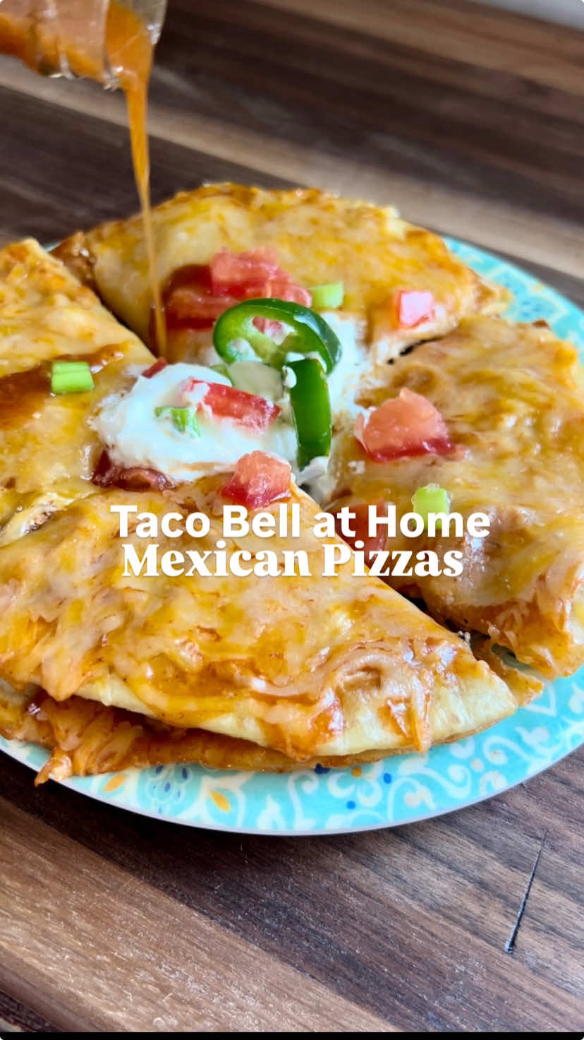 Taco Bell 🔔 go to for me is a Mexican pizza, but ever since they took it away and brought it back, it just hasn't been the same! So we make it at home now😁 -makes 2 Mexican pizzas- 1lb ground beef 1/2 packet taco seasoning 1/2 cup olive or avocado oil, for frying 4 flour or almond flour tortillas 1/2 can refried beans (I heat mine with a few pieces of jalapeño) 1/2 cup enchilada sauce 1 cup 4-cheese blend Toppings as desired: sour cream, tomatoes, green onions, jalapeños, hot sauce INSTRUCTIONS 1. Preheat oven to 400. 2. Brown ground beef in a skillet on medium high. Remove from skillet and set aside. 3. In another skillet, heat oil on medium-high. Fry each side of the tortilla for 2-3 minutes, until browned. Set on paper towel to absorb excess oil. 4. Top one tortilla with refried beans and add ground beef. Top with other tortilla. 5. Add enchilada sauce, then cheese. 6. Bake for 8-10 minutes until melted.  7. Top as desired and enjoy!  #tacobell #mexicanpizza #EasyRecipes #easydinners #30minutemeals #copycatrecipe #kidfriendlyfood #thecookingmawma #fyp 