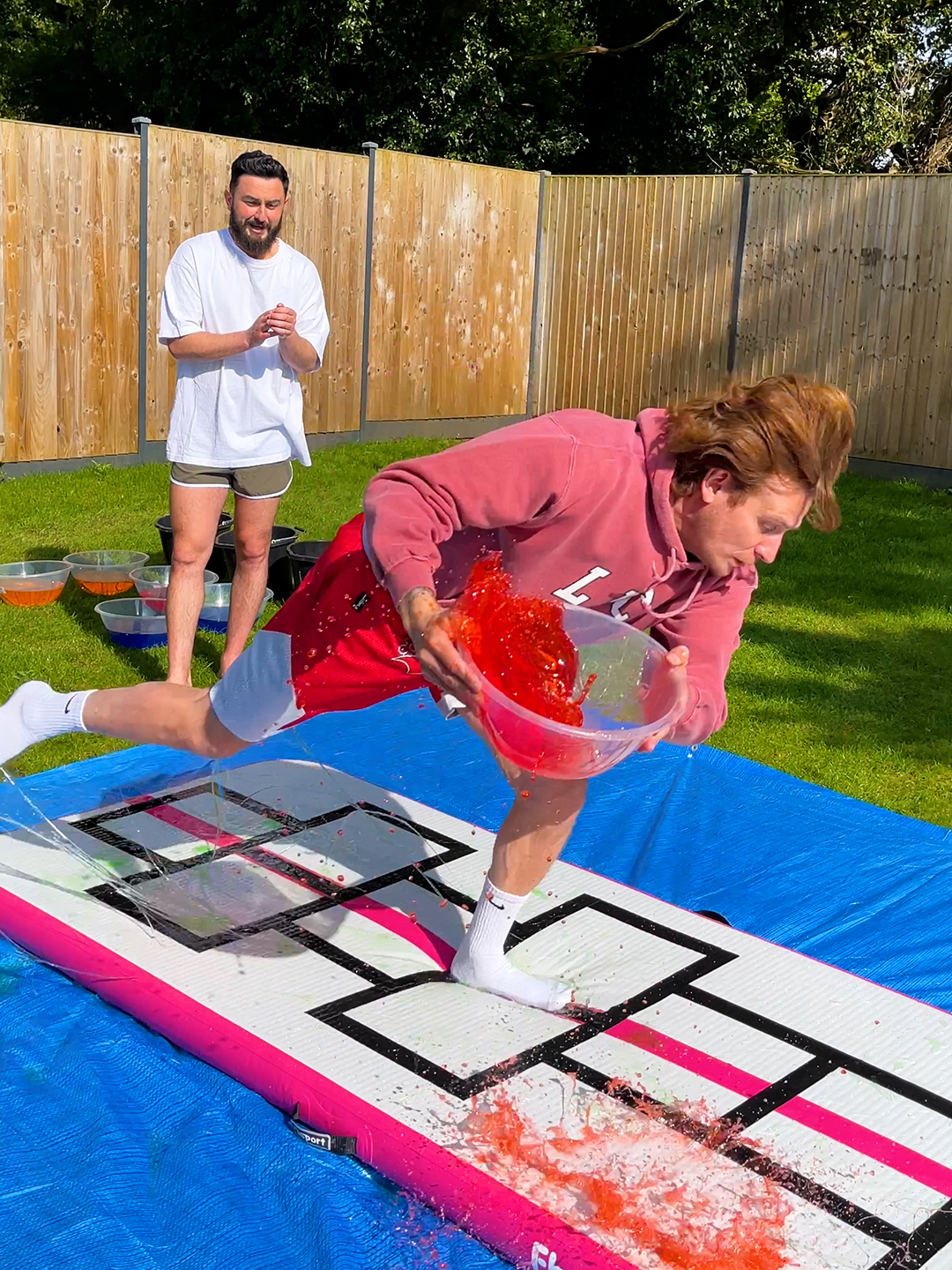 Slippery hopscotch is hilarious 🤣 #slipnslide #hopscotch #challenge