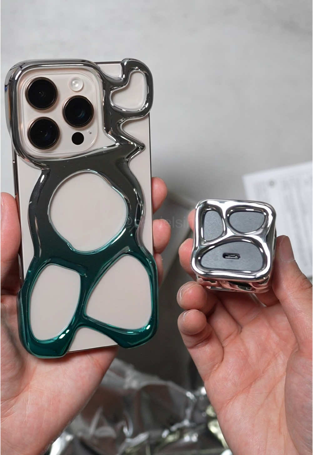 AM Emptiness Case for the iPhone 16 Pro and their wall charger has a matching design! Would you consider using this case? 