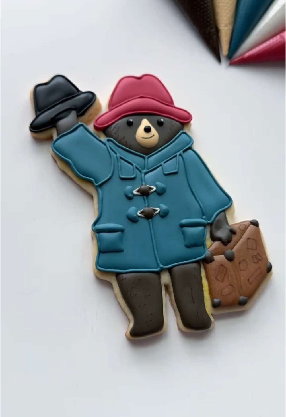 Replying to @katxxvzew7v Who should I make next?🐻🧳 recipes and supplies linked in my bio #paddingtoncookie #cookiedecorating #oddlysatisfying #asmr 