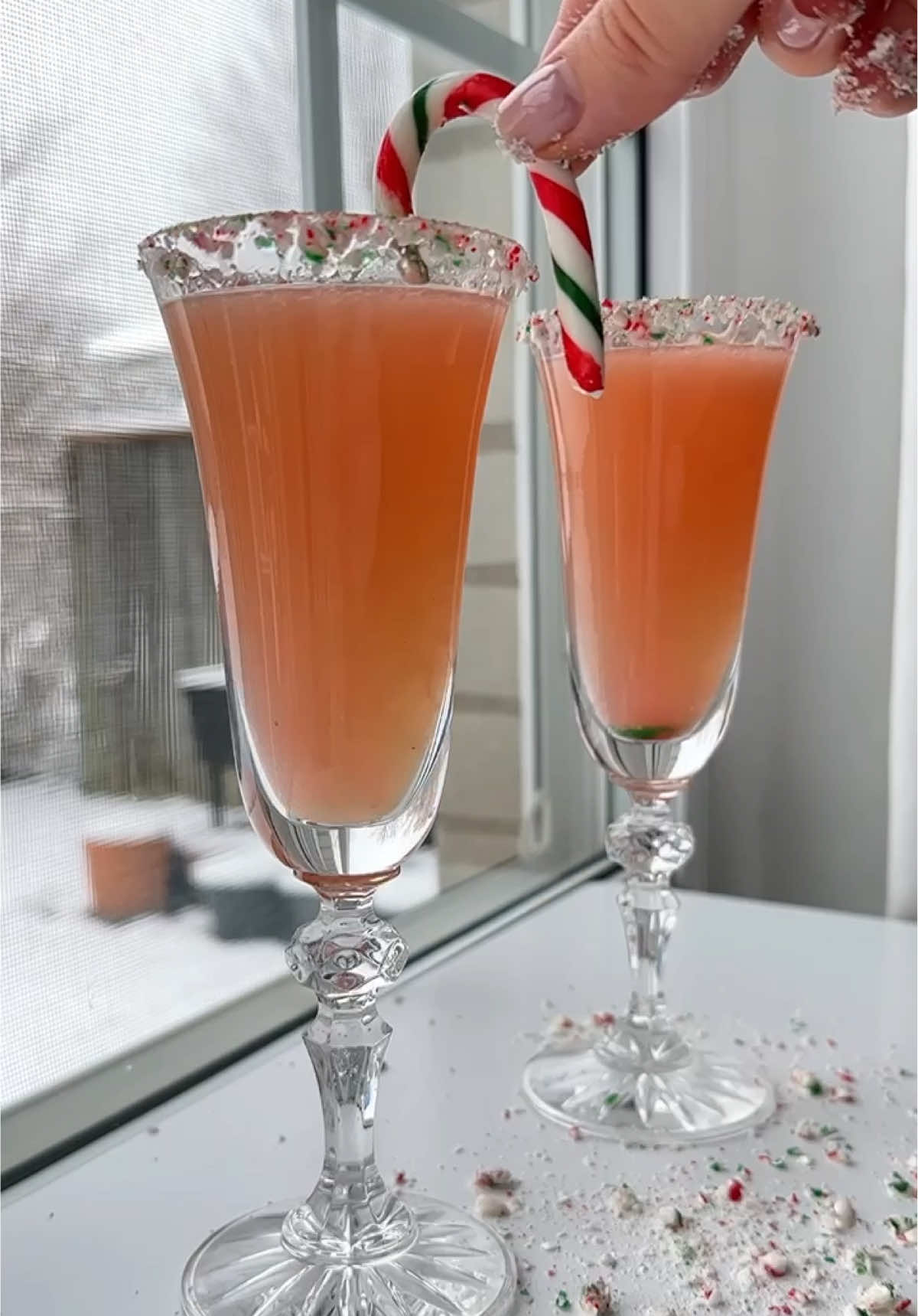 ✨Holiday Candy Cane Prosecco✨ My three-ingredient Holiday Candy Cane 🍭Prosecco will be your new favorite drink. This festive drink is perfect for hosting, and can absolutely be made into a fun mocktail for the kids/teens, or anyone that doesn’t drink. Ingredients * crushed candy canes, I used 5 small candy canes * Champagne or Prosecco, measure with your heart * fresh grapefruit juice (to top up with), or any juice you like * lime juice or grapfruit juice , for the rim https://themodernnonna.com/holiday-candy-cane-prosecco/ #holidaydrinks #prosecco #holidayrecipes #holidaytok #FoodTok #recipetok 