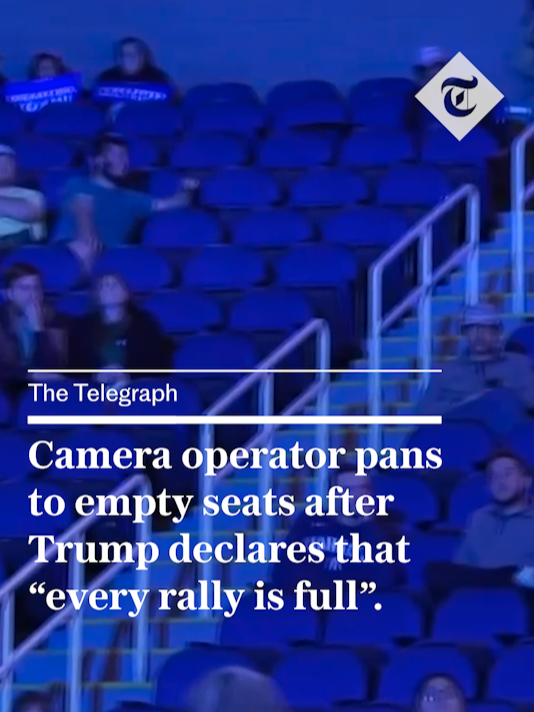 A camera operator pans to empty seats after Trump declares that 