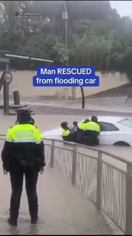 A video from the Police of Catalonia captured the miraculous moment a Spanish rescue team saved a man from being trapped in his car as floodwaters surged around him in Barcelona. The city has been hit with heavy rain, just days after a storm claimed at least 217 lives in Valencia. 🎥 X / mossos #spain #barcelona #rescue #flood #valencia #europe 